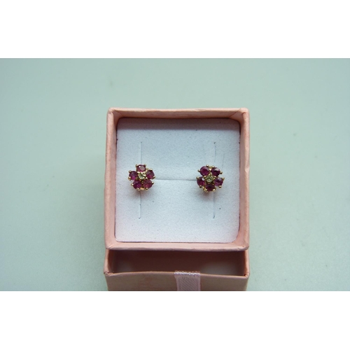 981 - A pair of 9ct gold ruby and diamond cluster ear studs, 1.3g