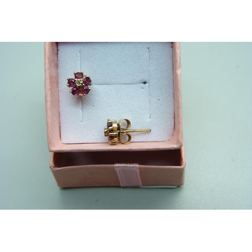 981 - A pair of 9ct gold ruby and diamond cluster ear studs, 1.3g