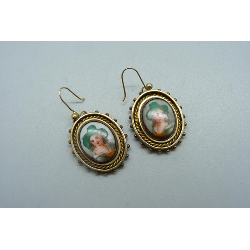 987 - A pair of gilt metal portrait earrings