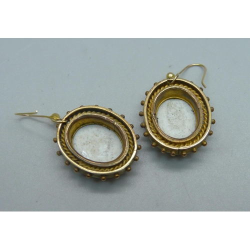 987 - A pair of gilt metal portrait earrings