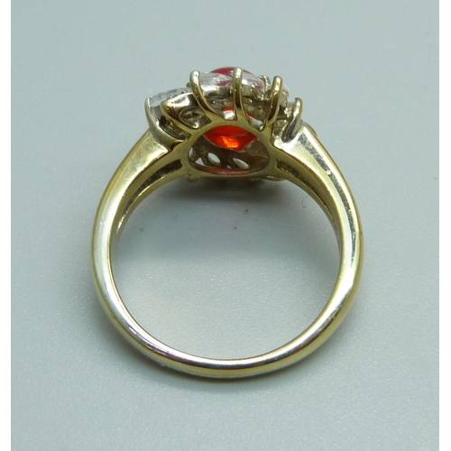 991 - A silver gilt, red/orange cabochon and white stone ring, S