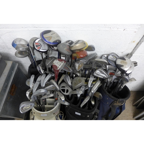 2325 - Seven bags of various golf irons, drivers and putters