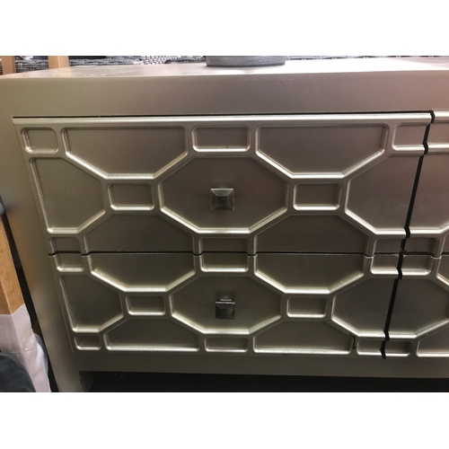 1404 - A champagne painted geometric low sideboard