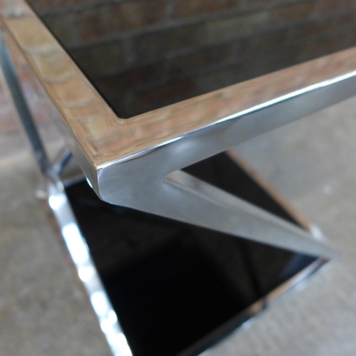 1419 - A chrome and black glass lamp table (H=50cm x W=45cm x D=45cm)  *This lot is subject to VAT