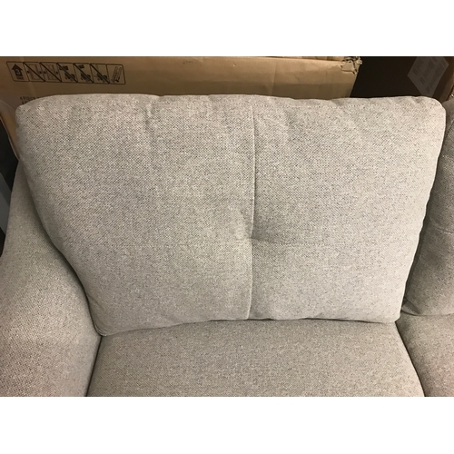 1437 - An oatmeal upholstered three seater sofa