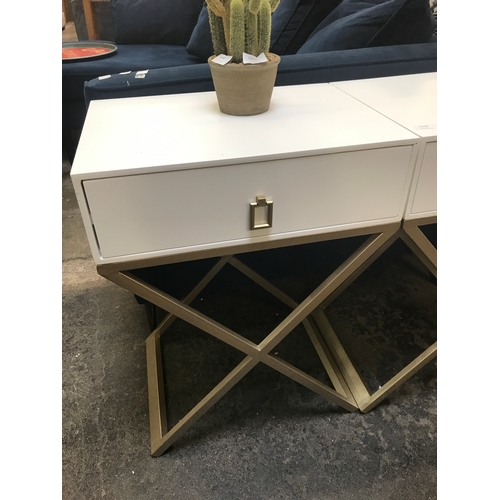 1448 - A pair of white bedside tables with cross legs