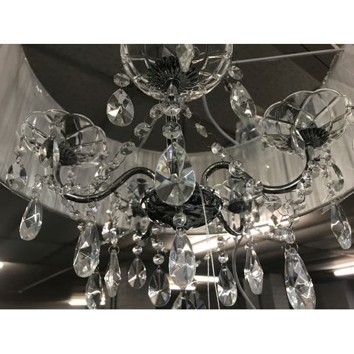 1456 - A chrome five arm chandelier with white shade and glass droplets