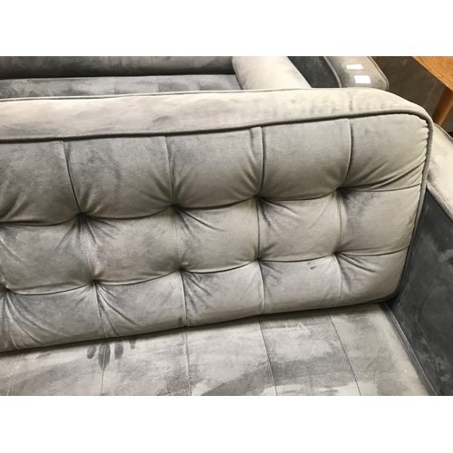 1459 - A pair of grey velvet buttoned back three seater sofas