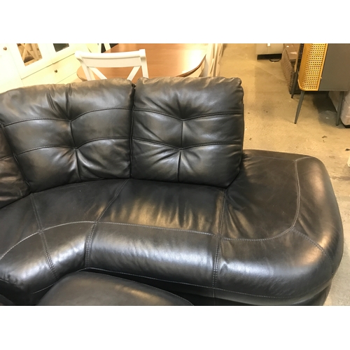 1535 - A black leather corner sofa