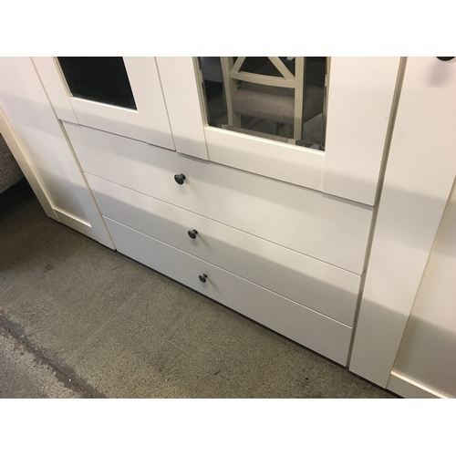 1538 - A white mirrored four door wardrobe  * This lot is subject to VAT