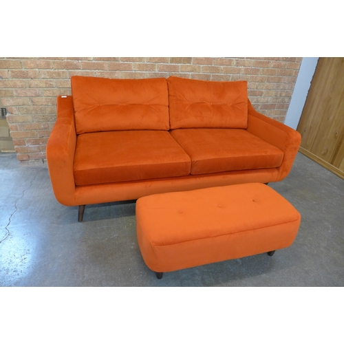 1301 - A tangerine velvet buttoned back three seater sofa and footstool (H=90cm x W=187cm x D=90cm)