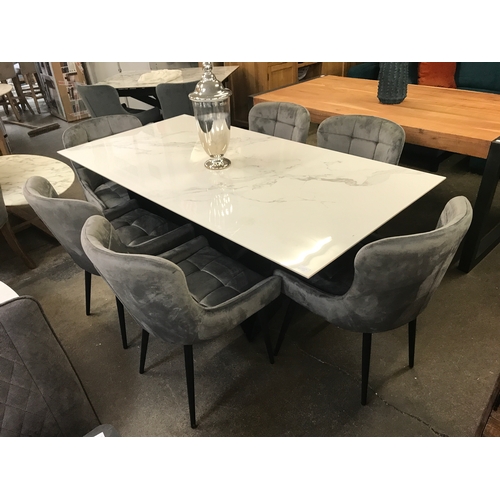 1350 - A Marvel dining table and six Kos granite chairs  * This lot is subject to VAT