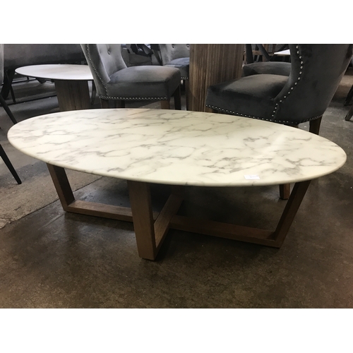 1455 - An oval oak effect and marble coffee table  * This lot is subject to VAT