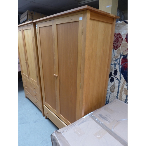 1502 - A lady's oak two door wardrobe with single drawer to the base (H=190 x W=110 x D=62cm)