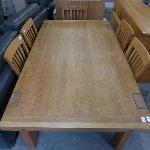 1528 - An oak extending dining table and six chairs (Table dimensions = H=77 x W= 178 x D=100cm)