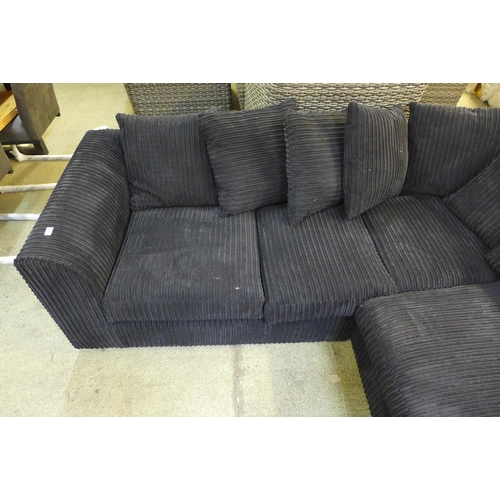 1541 - A black jumbo cord corner sofa (H=80 x W=217 x D=170cm)