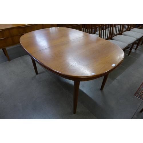 68 - A McIntosh teak extending dining table