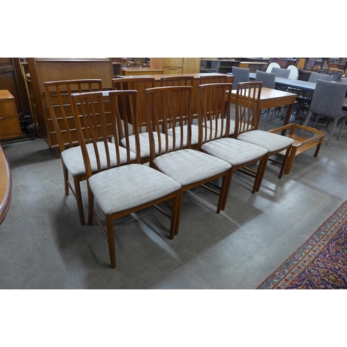 77 - A McIntosh teak extending dining table and eight chairs