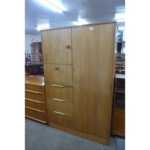 84 - A teak tallboy