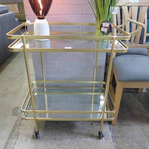 1387 - A gold metal and glass drinks trolley