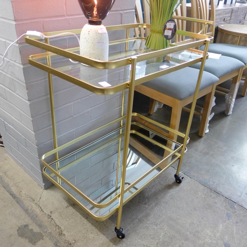 1387 - A gold metal and glass drinks trolley