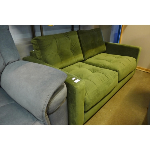 1391 - A forest green velvet pinched back two seater sofa