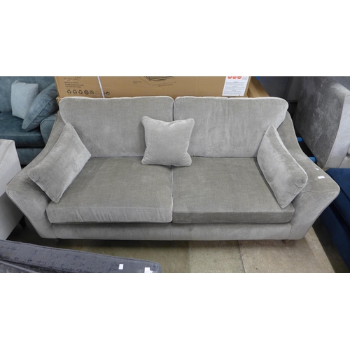 1422 - A mink upholstered three seater sofa