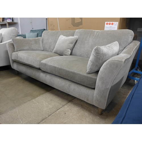 1422 - A mink upholstered three seater sofa