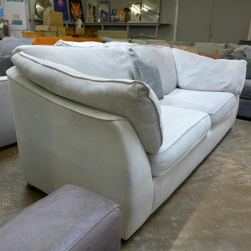 1438 - A Halley cloud white upholstered three seater sofa