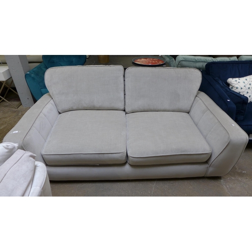 1441 - A shark grey upholstered four seater sofa