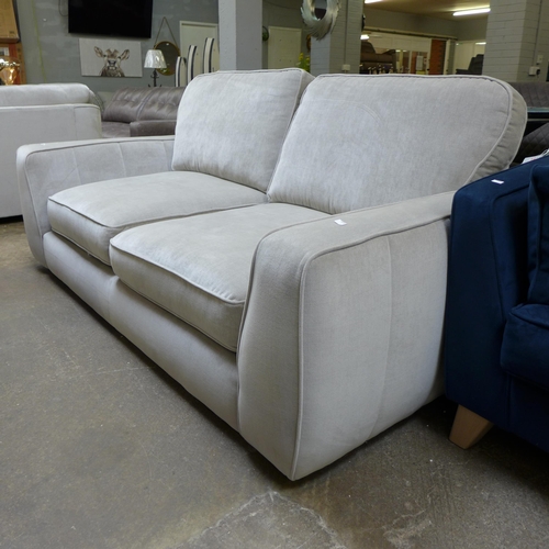 1441 - A shark grey upholstered four seater sofa