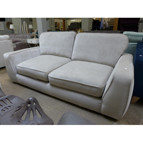 1441 - A shark grey upholstered four seater sofa