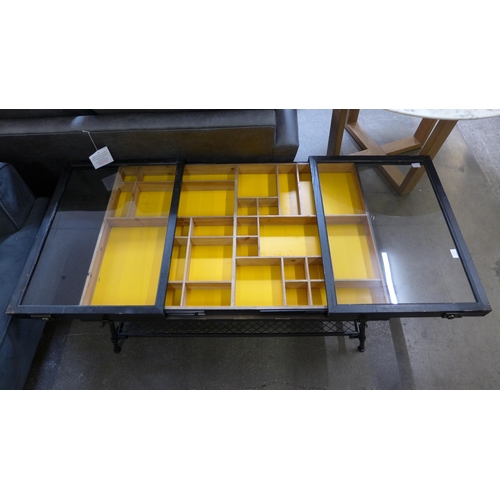 1472 - A collector's cabinet industrial style coffee table