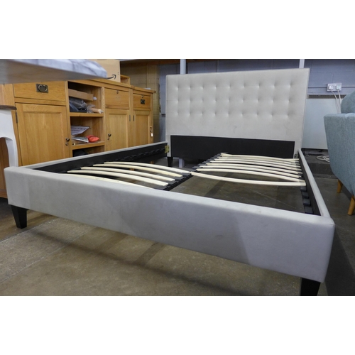 1479 - A champagne upholstered double bed frame, missing some slats