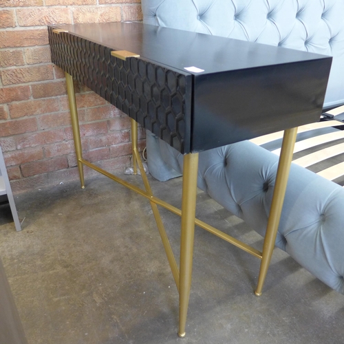 1490 - A black console table with gold legs