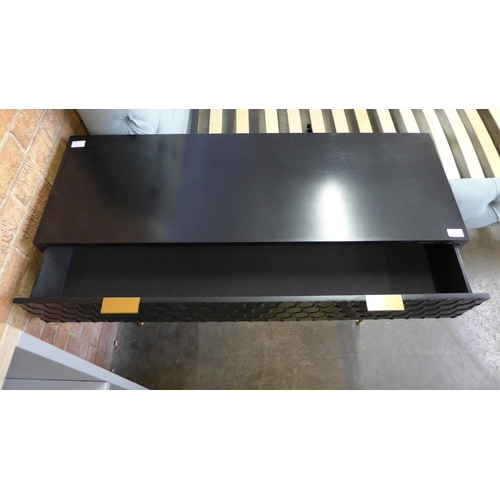 1490 - A black console table with gold legs