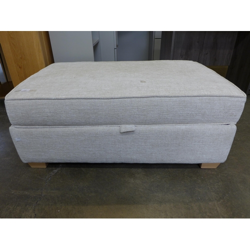 1496 - A cream upholstered large rectangular ottoman footstool, Hinge damaged