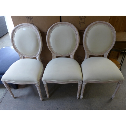 1498 - A set of three upholstered dining chairs