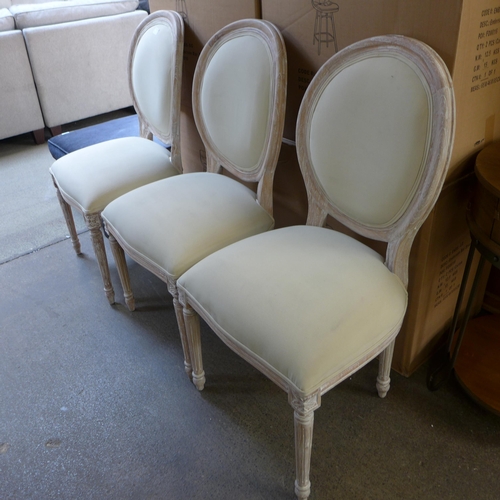 1498 - A set of three upholstered dining chairs