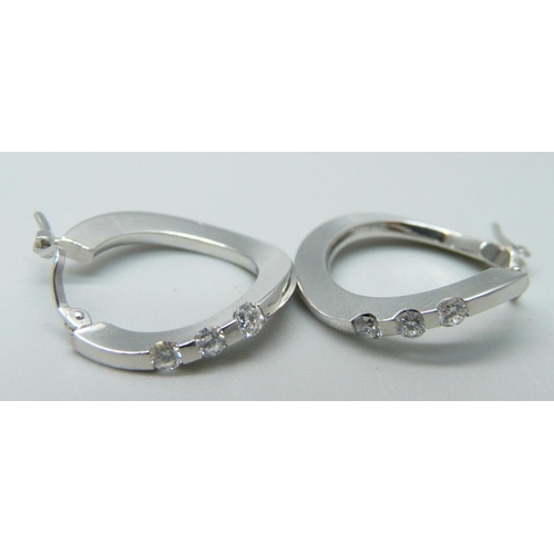 1042 - A pair of 18ct gold and diamond hoop earrings, 5g