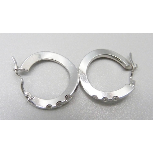 1042 - A pair of 18ct gold and diamond hoop earrings, 5g