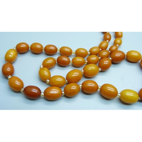 1055 - Two sets of butterscotch amber beads