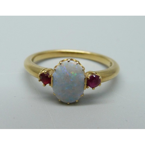 1061 - A vintage 18ct gold, opal and ruby ring, (three small chips to the opal), 3.4g, N