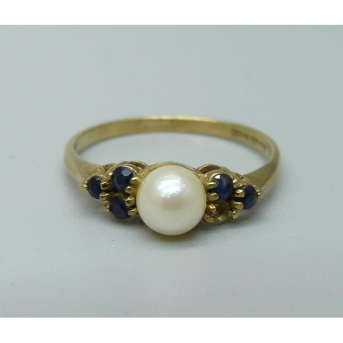 1064 - A 9ct gold, pearl and blue stone ring, 1.5g, N, lacking one blue stone