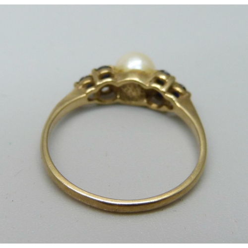 1064 - A 9ct gold, pearl and blue stone ring, 1.5g, N, lacking one blue stone