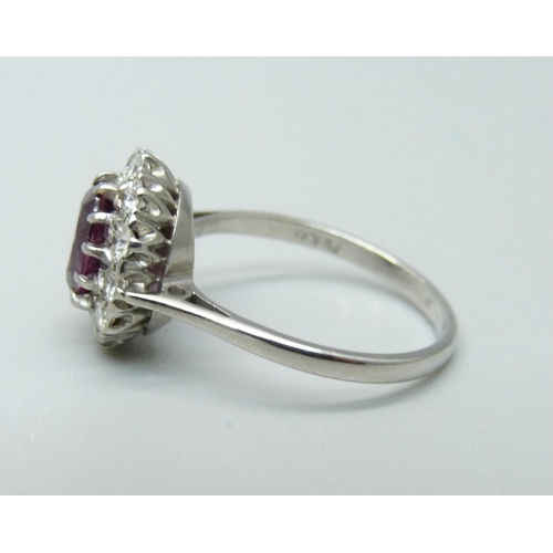 1086 - An 18ct white gold, diamond and almandine garnet ring, 3.6g, O