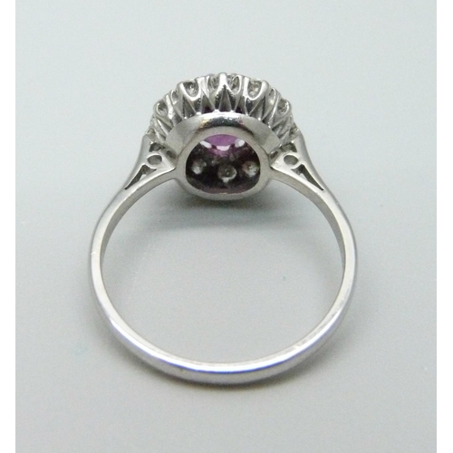 1086 - An 18ct white gold, diamond and almandine garnet ring, 3.6g, O