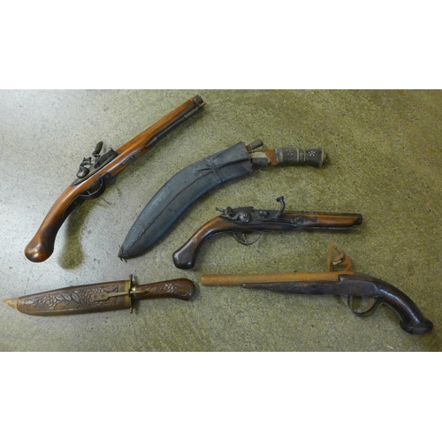 1107 - Replica flintlock pistols and a kukri **PLEASE NOTE THIS LOT IS NOT ELIGIBLE FOR POSTING AND PACKING... 