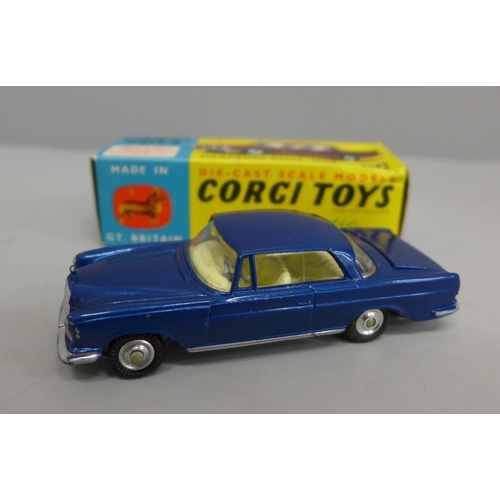 623 - A Corgi no.253 Mercedes 220SE Coupe with blue body and lemon interior, luggage in boot, spare wheel ... 