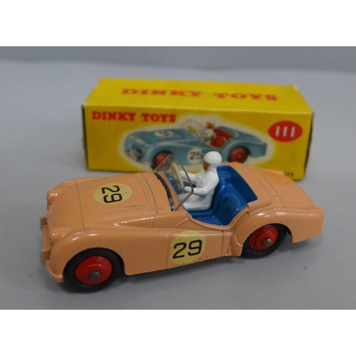 626 - A Dinky Toys 111 TR2 Sports Car in peach with blue interior, boxed